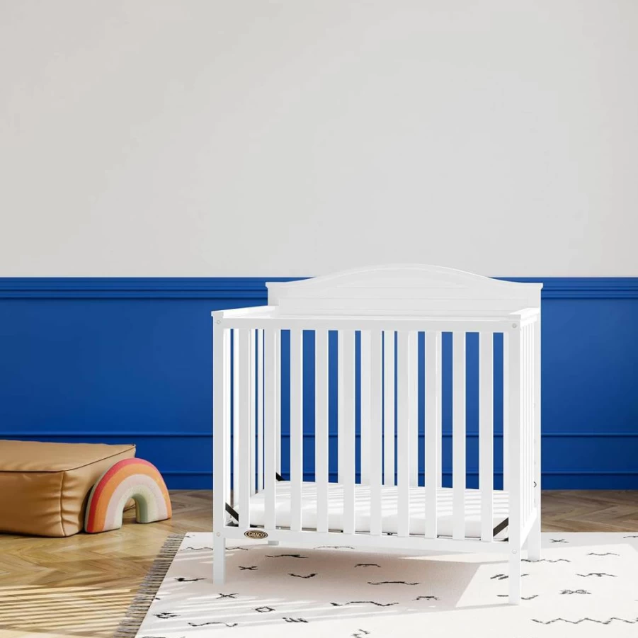 Graco Stella 4-in-1 Convertible Mini Crib to Twin Bed with Mattress – Driftwood Finish, Water-Resistant Cover, Headboard & Footboard